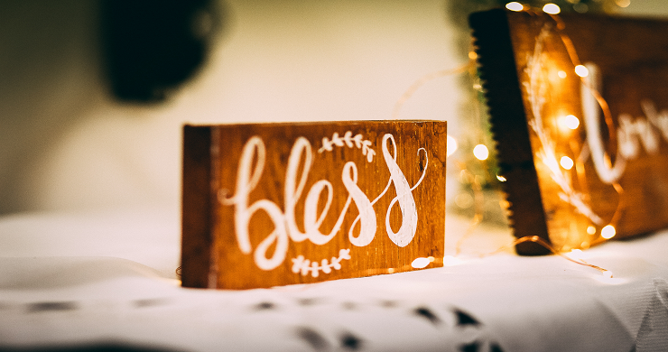 Picture of a wooden block with "Bless" written on it